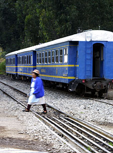 Quecha woman crossed the tracks in front of the Machu Picchu train